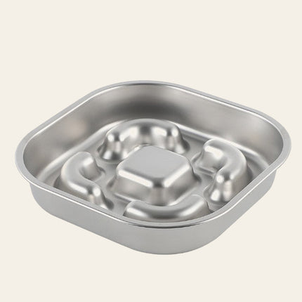 Gamelle anti-glouton carrée en inox, vue de trois quarts, avec des reliefs emboutis au fond.